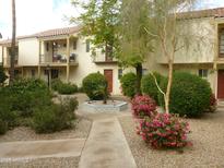 Charming two-story condo with well-maintained landscaping and inviting entryway at 4818 N 73Rd St, Scottsdale, AZ 85251