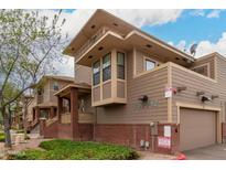 Side exterior view of the townhome featuring brick accents and well-placed windows, showcasing quality construction at 702 S Beck Ave, Tempe, AZ 85281