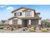 Charming two-story home featuring a neutral palette, tile roof, and neatly landscaped front yard at 14630 W Sand Hills Rd, Surprise, AZ 85387