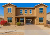 A charming two-story home with a private front entrance and desert landscaping at 16510 W Tether Trl, Surprise, AZ 85387