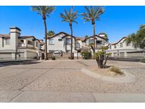 Charming gated community entrance featuring beautiful landscaping and well-maintained facades at 2992 N Miller Rd # 103, Scottsdale, AZ 85251