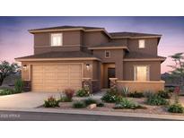 Charming two-story home boasting a well-manicured front yard with desert landscaping and a two-car garage at 17818 W Getty Dr, Goodyear, AZ 85338