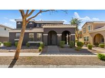 Charming two-story home with a welcoming arched entryway and well-maintained landscaping at 2983 E Harrison St, Gilbert, AZ 85295