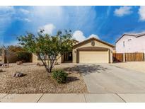 Charming single-story home with a two-car garage and well-maintained desert landscaping at 3424 E Flamingo Ct, Gilbert, AZ 85297