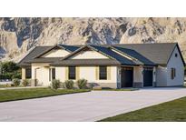 Charming single-story home featuring a three car garage, neutral colors, and a well-manicured lawn at 740 W Patrick Pl, San Tan Valley, AZ 85143