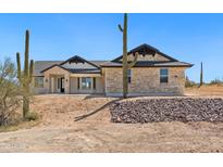 Beautiful stone-clad home featuring desert landscaping and a charming facade at 740 W Patrick Pl, San Tan Valley, AZ 85143