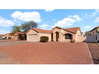 Charming single story home with a two car garage and well maintained desert landscaping at 9230 W Charleston Ave, Peoria, AZ 85382