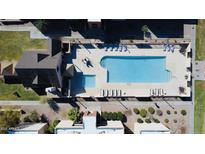 Aerial view of a community pool with lounge chairs, a large swimming pool, and a smaller wading pool at 1340 N Recker Rd # 219, Mesa, AZ 85205