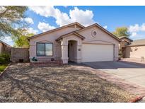 Charming single-story home with desert landscaping, attached garage, and inviting entryway at 3151 W Donald Dr, Phoenix, AZ 85027