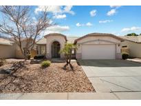 Charming single-story home with desert landscaping, covered entryway, and a two-car garage at 383 E Jasper Dr, Chandler, AZ 85225