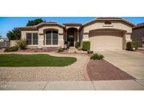 Charming single-Gathering home featuring manicured landscaping and a welcoming front entrance at 6494 W Matilda Ln, Glendale, AZ 85308