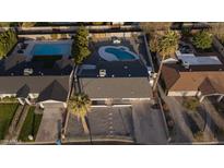 Aerial view of the home, highlighting the backyard oasis with a free form pool and mature landscaping at 7819 N 17Th Ave, Phoenix, AZ 85021