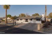 Inviting home featuring a manicured front yard, providing a warm and welcoming curb appeal for a potential buyer at 7819 N 17Th Ave, Phoenix, AZ 85021