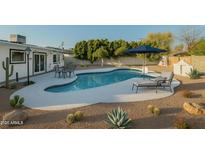 Inviting backyard pool area with a lounge chair and cacti landscaping at 7819 N 17Th Ave, Phoenix, AZ 85021