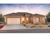 Inviting single-story home features a tile roof, arched window detail, and a two-car garage at 7854 W Mockingbird Way, Florence, AZ 85132