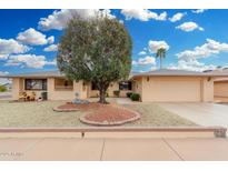 Charming single-story home with a low-maintenance desert landscaped front yard and an attached two-car garage at 12403 W Allegro Dr, Sun City West, AZ 85375