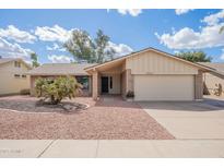 Charming single-story home featuring a two-car garage, manicured front yard, and appealing curb appeal at 10903 E Sahuaro Dr, Scottsdale, AZ 85259