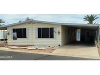 Charming single-story home featuring a carport and well-kept landscaping at 3104 E Broadway Rd # 268, Mesa, AZ 85204