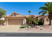 Charming single-story home featuring desert landscaping, a barrel tile roof, and a two-car garage at 3191 N 160Th Ave, Goodyear, AZ 85395