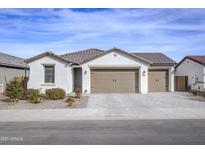 Charming single-story home with a two-car garage and desert landscaping for low maintenance at 40440 W Haley Dr, Maricopa, AZ 85138