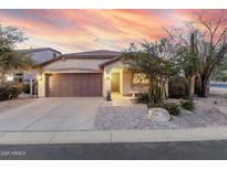 Charming single-story home showcasing desert landscaping and a spacious two-car garage at 4760 E Amber Sun Dr, Cave Creek, AZ 85331