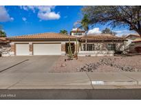 Charming single-story home with a three-car garage and desert landscaping at 6118 E Star Valley St, Mesa, AZ 85215