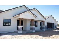 Charming single-story home with a tile roof, stucco siding, and a covered porch with timber columns at 1645 E Minton St, Mesa, AZ 85203