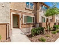 Charming townhome featuring desert landscaping, covered entry and a two-tone stucco facade at 2632 S Peppertree Dr # 104, Gilbert, AZ 85295