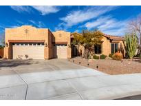 Charming single-story home with a three-car garage, desert landscaping, and a spacious driveway at 5215 S Monte Vista St, Chandler, AZ 85249