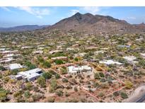 Expansive desert home with stunning mountain views and a large private lot outlined in red at 5805 E Agave Pl, Carefree, AZ 85377