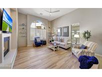 Bright living room featuring tile flooring, large windows and comfortable seating arrangements at 20802 N Grayhawk Dr # 1017, Scottsdale, AZ 85255