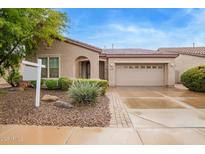 Charming home featuring a two-car garage, desert landscaping, and inviting arched entryway at 4121 E Narrowleaf Dr, Gilbert, AZ 85298