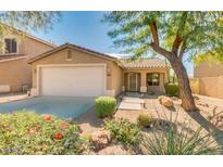 Charming single-story home with a desert-landscaped front yard and two-car garage at 4533 E Coyote Wash Dr, Cave Creek, AZ 85331