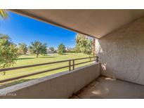 View from balcony features lush green landscaping and blue sky at 7350 N Via Paseo Del Sur -- # O212, Scottsdale, AZ 85258