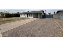 Charming single-story home featuring a covered carport and low-maintenance gravel landscaping at 1210 E Marny Rd, Tempe, AZ 85288