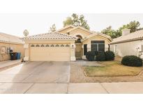 Charming single-story home showcasing a well-maintained front yard and two-car garage at 16634 N 33Rd Way, Phoenix, AZ 85032