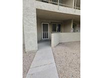 The exterior features a cozy entryway with a security door and well-maintained walkway at 2220 W Dora St # 114, Mesa, AZ 85201