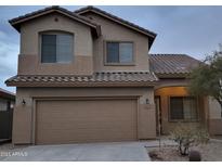 Charming two-story home with a two-car garage and desert landscaping at 3829 W Ashton Dr, Anthem, AZ 85086