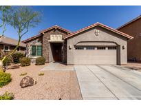 Charming single-story home featuring a stone facade, well-maintained landscaping, and a two car garage at 4116 E Roy Rogers Rd, Cave Creek, AZ 85331