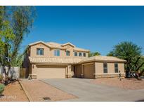 Charming two-story home with three-car garage and desert landscaping at 6812 S 45Th Ave, Laveen, AZ 85339