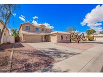 Charming two-story home with a three car garage and desert landscaping at 6812 S 45Th Ave, Laveen, AZ 85339