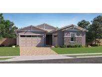 Charming single-story home featuring a brick driveway, a gray exterior, and a two-car garage at 974 W Saddle Run, Apache Junction, AZ 85120