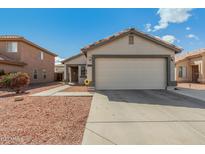 Charming home featuring a well-maintained front yard and a convenient two-car garage at 11813 W Sierra St, El Mirage, AZ 85335