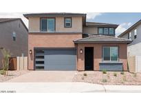 Charming two-story home with a modern garage door and neutral color palette at 40234 N Alegre Dr, San Tan Valley, AZ 85140
