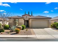 Charming home showcasing desert landscaping, tiled roof, and an attached two-car garage at 4459 E Donato Dr, Gilbert, AZ 85298