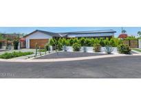 Modern home boasts elegant landscaping with cacti, shrubs, and a well-maintained black gravel area at 5812 N 44Th Pl, Phoenix, AZ 85018
