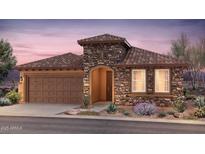 Beautiful single story home with a stone facade, tile roof, landscaped yard, and a two car garage at 7851 W Meadowlark Way, Florence, AZ 85132