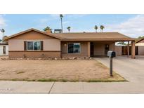 Charming single-story home with a covered porch and a low-maintenance front yard at 12402 N 36Th Dr, Phoenix, AZ 85029