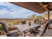 Covered patio boasts a dining table, chairs, and lovely views at 16203 E Ridgeline Dr, Fountain Hills, AZ 85268