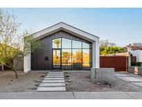 Modern exterior showcasing geometric design, desert landscaping, and large reflective windows at 2336 N 12Th St, Phoenix, AZ 85006